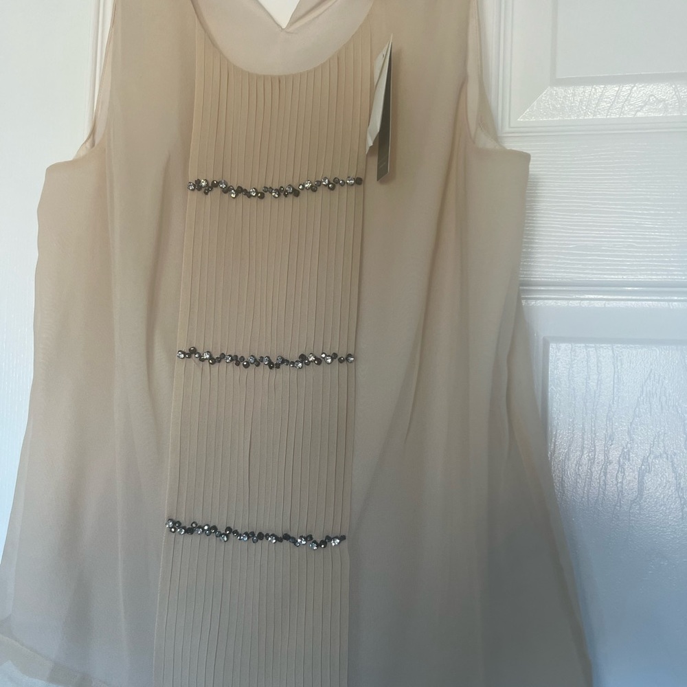 Add a little sparkle to your wardrobe. Never worn.